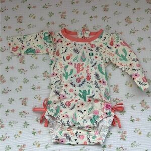 Ruffle Butts Desert Blossom one piece rash guard  with Pink and Green Accents